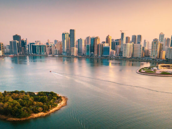 Emirate of Sharjah cityscape waterfront rising above Al Noor Island at city downtown in the UAE
