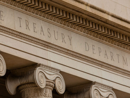Close-Up of the Lettering The Treasury Department at the Treasury Department Building in Washington, DC-Shutterstock_1548453638
