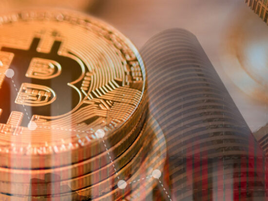 Close up bitcoin and digital stock market graph bar on black. Cryptocurrency. Bitcoin Stock Growth-Shutterstock_2156024949