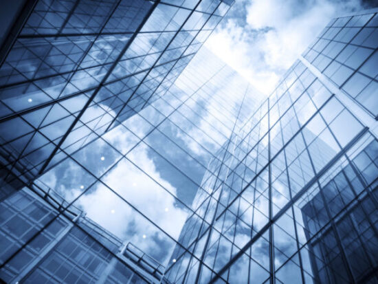 skyscraper reflecting the blue sky and clouds