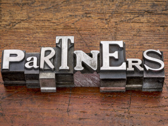 partners word in metal type
